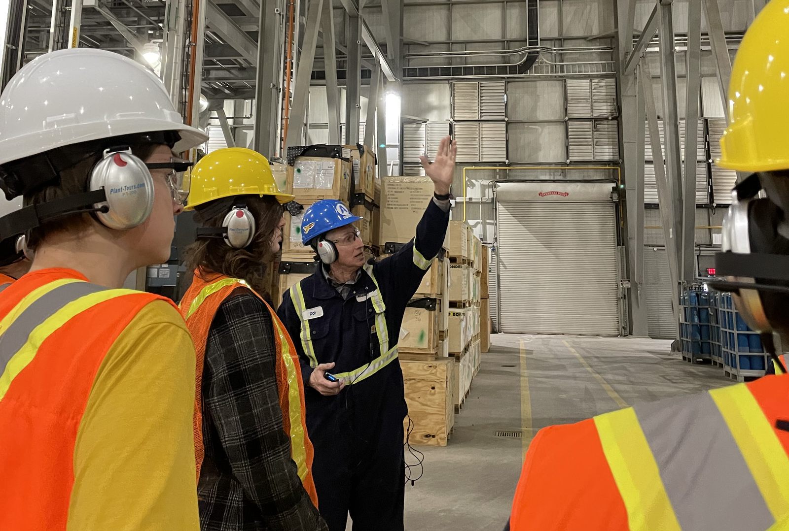 Students in hard hats on a plant tour